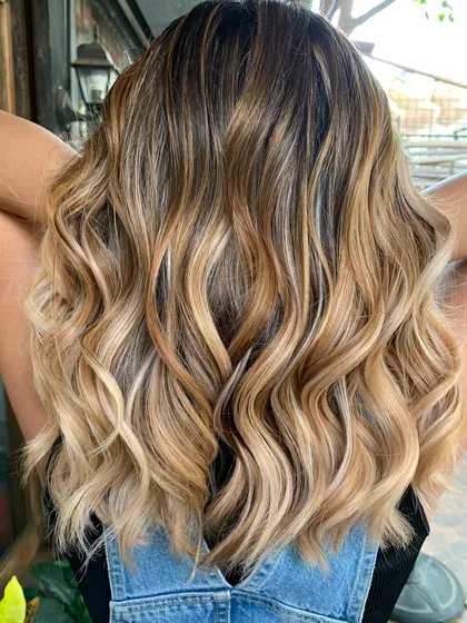 Another view of the 'Cookies and Cream' blonde balayage. The blend of warm and cool tones is just perfect.