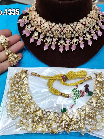 A collection of pink kundan chokers, showing different styles and designs available for customization.