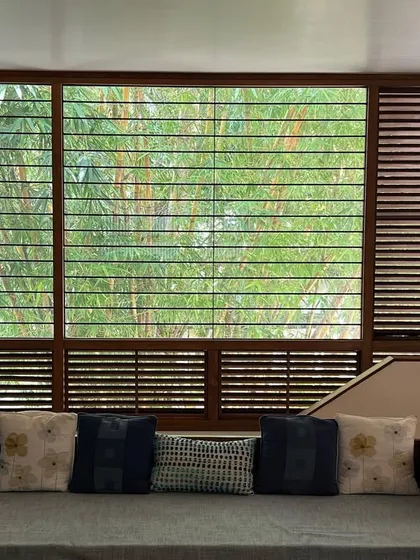 A large window in our studio living space frames the dense foliage of the bamboo outside. The view becomes a living backdrop, filtering light and bringing the tranquility of nature indoors.