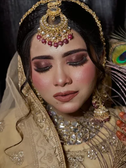 The artistry of the eye makeup is the focus of this shot. The rich, dark eyeshadow is blended perfectly, creating a deep and soulful look.