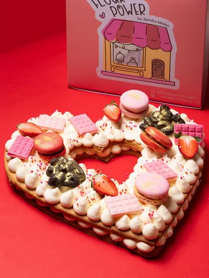 Say it with a tart. My 'Only Love Tart' is a heart-shaped shortbread cookie layered with luscious cream and decorated with macarons, fresh strawberries, and chocolate. It's a beautiful and delicious centerpiece for Mother's Day, anniversaries, or Valentine's Day.
