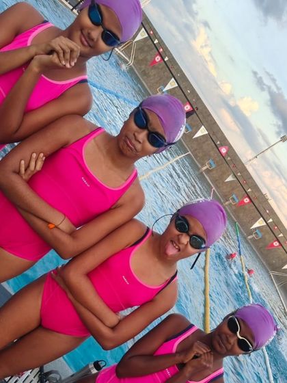 The girl squad, rocking their pink suits and team caps. This wasn't planned, but it shows the fun and friendship that develops within the team. A strong team spirit is just as important as fast swimming.