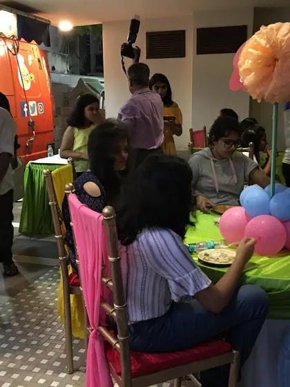 My service allows you to be a guest at your own party. While I manage the kitchen and serving, you can spend your time mingling with friends and family, like in this candid moment from a recent event.