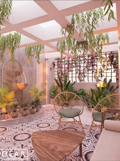 The terrace of the La Lagune Penthouse is a peaceful oasis in the city. We used patterned tiles, rattan furniture, and a serene water fountain to create a space perfect for unwinding.