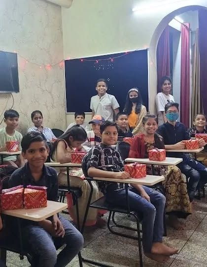 Distributing gifts to our students during the Diwali festival. We believe in sharing joy and making every festival special for our students.