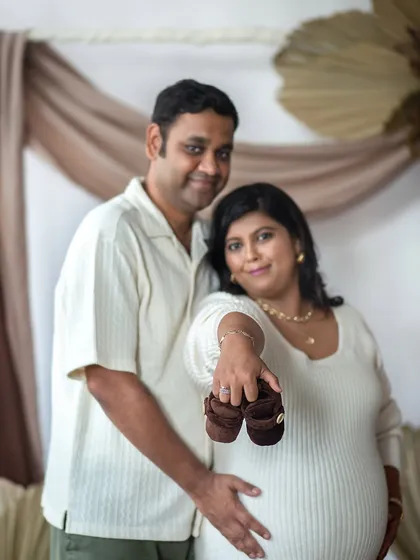 A close-up shot focusing on the baby shoes, a sweet symbol of the new life you are about to welcome.
