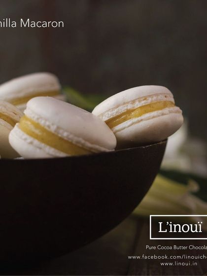 The classic Vanilla Macaron, with its delicate white shell and creamy vanilla buttercream filling. This image showcases the simple elegance and pure flavour of a timeless favourite.