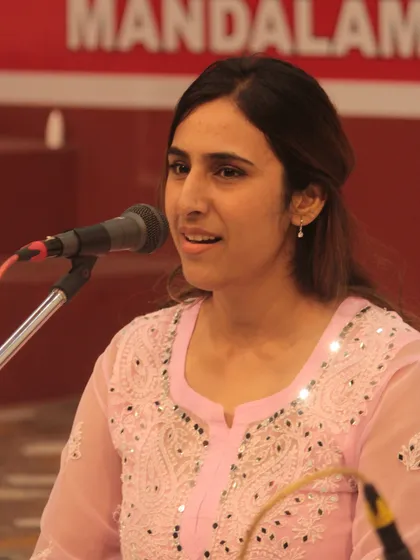 The bright and happy face of a student enjoying her moment on stage.