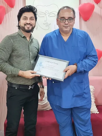 Receiving a certificate of training within my clinic. I believe that success comes from creating value, and for me, that means continuously honing my skills in cosmetic and hair transplant surgery.