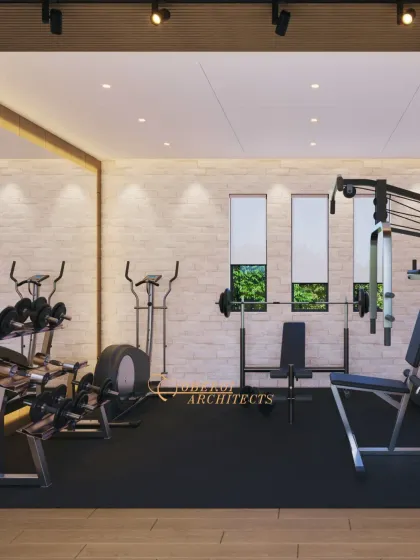 The gym features a full-length mirror wall, which enhances the sense of space and is essential for monitoring form during exercise.