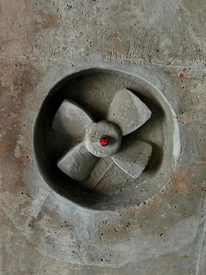 A close-up of the fan detail in Archana Hande's studio. This playful element, complete with a red bindi at its center, is an example of how we embed art and personality directly into the architectural fabric of a home.