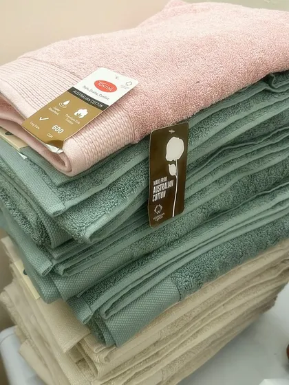 A stack of plush Australian cotton bath sheets I sourced. I personally check the quality to make sure they are thick, super absorbent, and come in beautiful, calming colours for your bathroom.