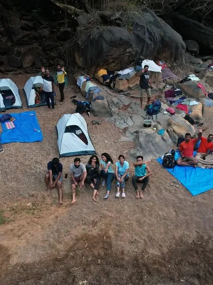An aerial view of our campsite by the Aghanashini river, showing the tents set up on the sandy bank.