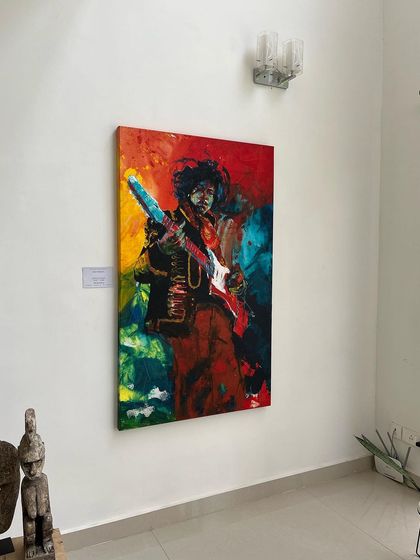 My Jimi Hendrix painting on display in the gallery. This 5x3 feet acrylic on canvas is all about capturing the electrifying energy of a live performance through bold color and movement.