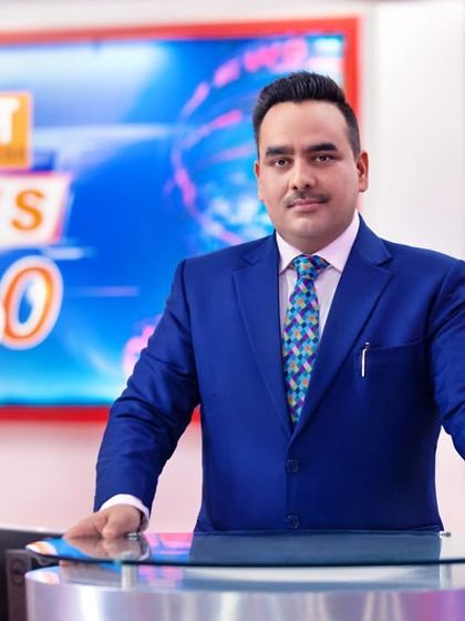 A professional corporate portrait for the launch of Bharat Express news channel, capturing the confidence of its leader, Upendrra Rai.