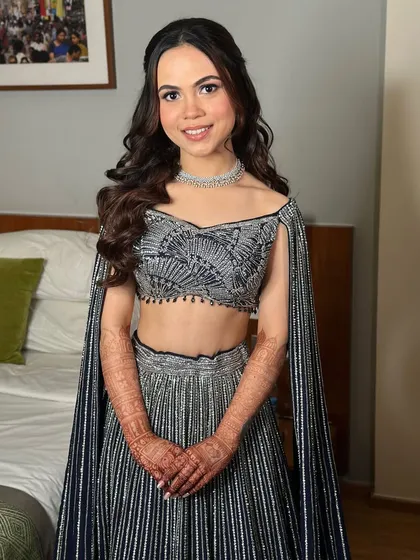 A smiling portrait of the bride. Her makeup is perfectly balanced, with a sheer, flawless finish and softly tinted lips.