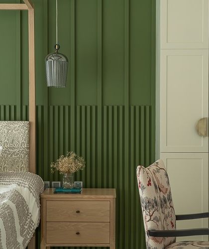 This bedroom is a breath of fresh air. I used calming green tones as a backdrop for a four-poster bed and a mix of patterned textiles. The space feels modern yet approachable, refined yet undeniably cozy.