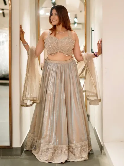 Another angle of this stunning silver-gold lehenga, showing off its beautiful flair and sparkle.
