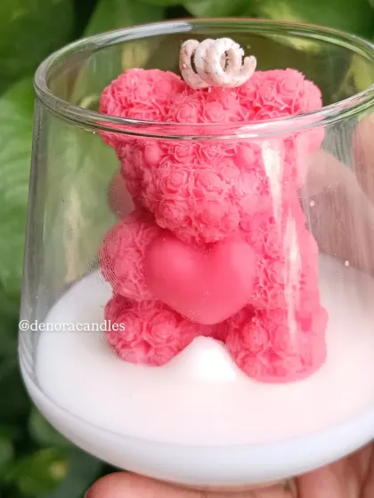 A clear, bright shot of the pink teddy bear jar candle.