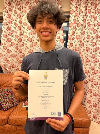 Another proud moment. This student proudly holds his Grade 2 certificate with distinction. We celebrate every milestone with our students.