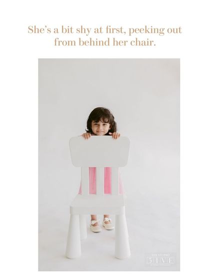 This is how many of our kids' portrait sessions begin, with a little shyness. We give them space and time, letting them peek out from behind a chair until they are comfortable.