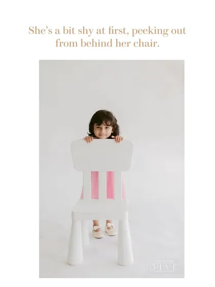 This is how many of our kids' portrait sessions begin, with a little shyness. We give them space and time, letting them peek out from behind a chair until they are comfortable.