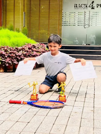 Results are earned, not given. We are incredibly proud of our young tennis player, Naksh Manan, showcasing his trophies after securing 2nd and 3rd place at the DLTA Mini Tennis Open Tournament. This is a testament to his hard work and our dedicated coaching.