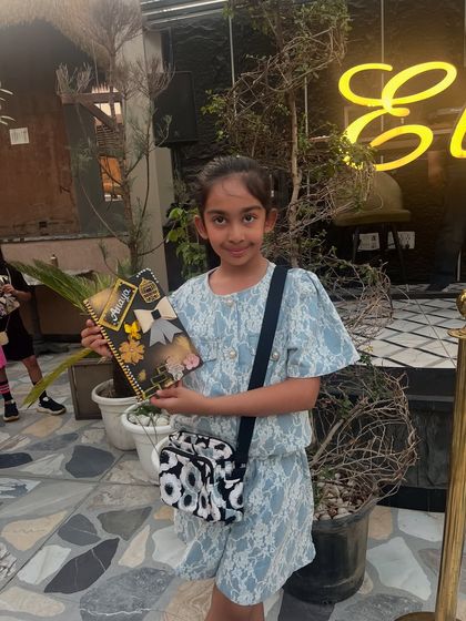 A very stylish student with her equally stylish diary, featuring a beautiful bow and floral design.