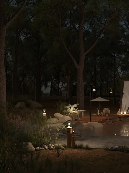 The pool area at night is a place of pure tranquility. The low-level lighting around the perimeter and in the surrounding landscape creates soft reflections on the water, making it a serene and magical spot.
