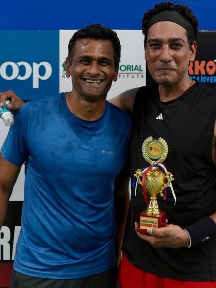 Two participants share a moment of victory. The smiles say it all. Our corporate events are designed to be a positive and memorable experience that boosts morale and team spirit.