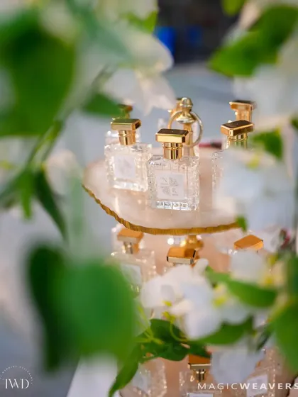 Even the smallest details are designed to complement our grand installations. Here, a custom perfume bar is nestled within the garden theme, offering guests a unique and fragrant wedding favor.