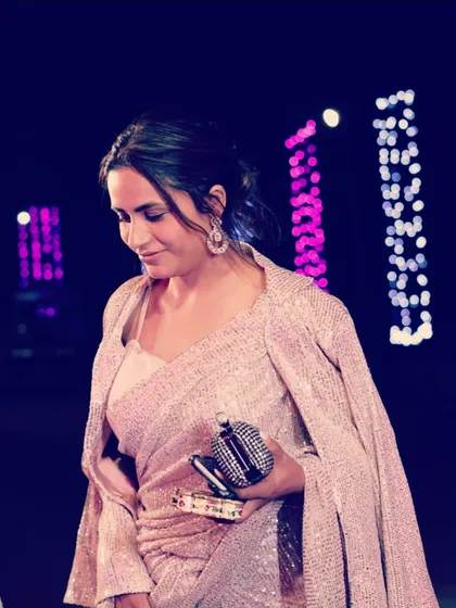 To give a modern twist to a traditional saree, I love adding a contemporary element like this matching sequined cape. It adds drama and sophistication, perfect for a cocktail party or sangeet.