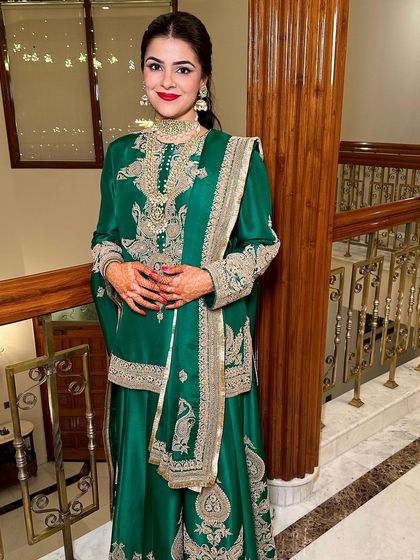 A classic red lip for a gorgeous Mehendi look. Paired with an emerald green Anamika Khanna outfit, this makeup is bold, timeless, and incredibly chic.