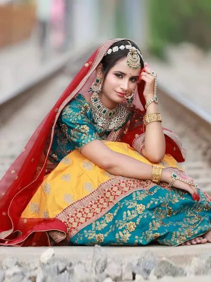 This shot is all about creating a cinematic moment. We took a gorgeous Heeramandi-inspired lehenga to an unconventional location like these railway tracks in Bangalore to create something truly memorable for a model's portfolio.