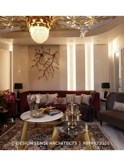 We brought a client's dream of living in a five-star hotel to life with this opulent living room. The design features a detailed false ceiling with a grand chandelier, rich velvet sofas, and custom wall art, all coming together to create an atmosphere of pure luxury and comfort.