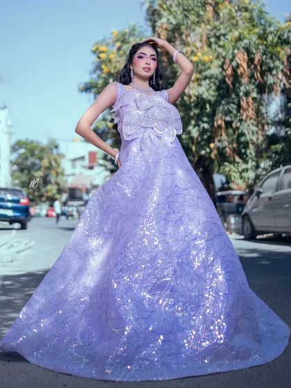 A wide shot showing the magnificent gown and how the makeup complements it.