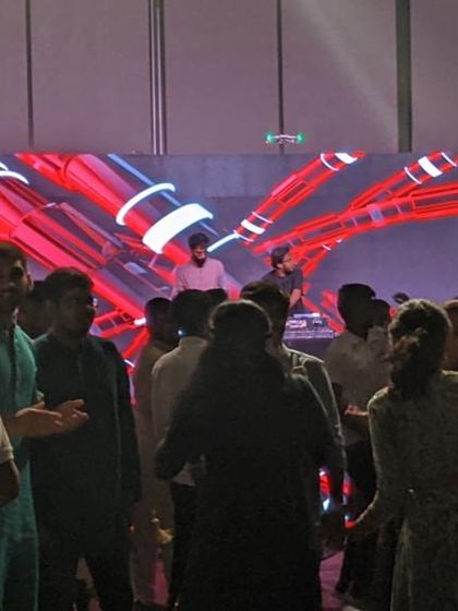 The employees hitting the dance floor at their company party.