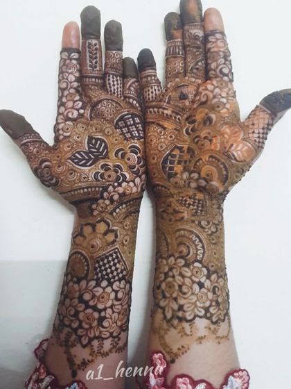 A stunning full-coverage design featuring a mix of floral, geometric, and traditional motifs.