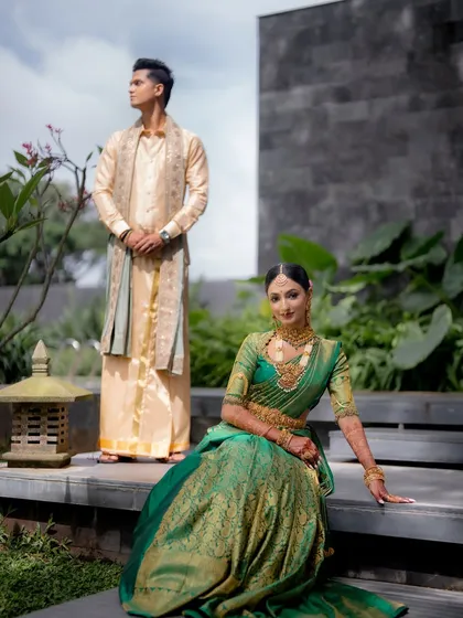 A portrait of the couple in a beautiful outdoor setting. The bride's makeup is set to withstand the Bengaluru climate, ensuring she looks fresh throughout her wedding day.