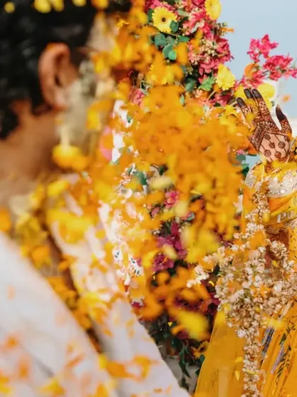 A playful moment between the couple during their beachside Haldi. The vibrant yellow outfits and cheerful atmosphere perfectly capture the spirit of this fun-filled tradition.