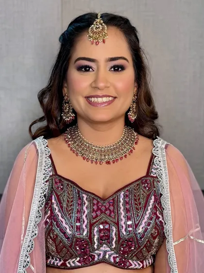 A happy, smiling bride. The soft glam makeup enhances her features, making her look and feel her absolute best.