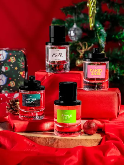 A classic Christmas-themed shot for a fragrance brand. We created a festive stack of red-wrapped gifts and placed the perfumes on top, with a decorated Christmas tree in the background to complete the merry scene.