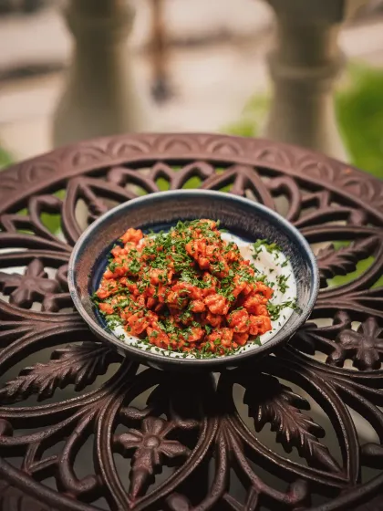 Inspired by Beiruti drama, these golden Batata Harra potatoes are bright with lemon zest, tangled in fresh herbs, and unapologetically bold.