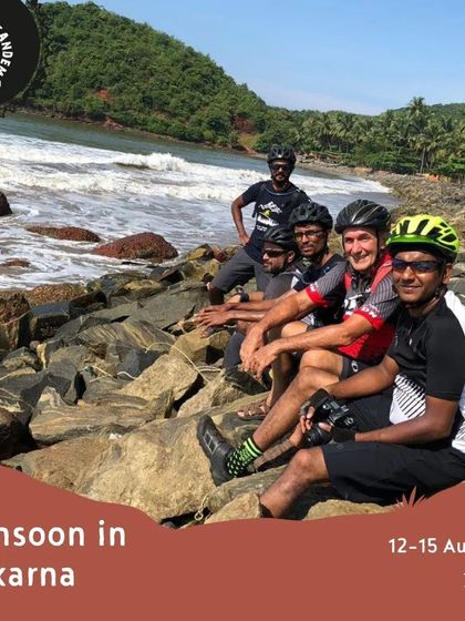 A group of riders relaxes on the rocks by the sea in Gokarna. The tour combines scenic riding with plenty of opportunities to enjoy the beautiful beaches.