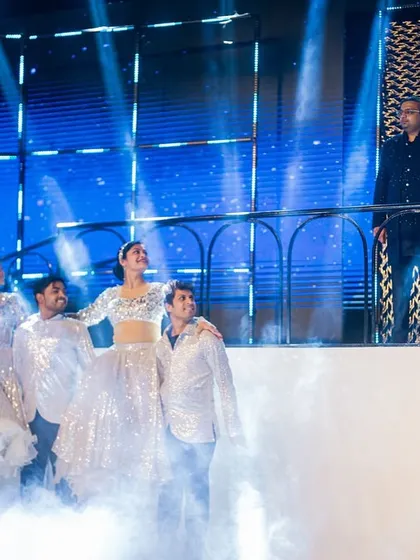 A grand reveal on a multi-level stage. We used a hydraulic lift and smoke effects for this dramatic entry, with the couple appearing on a balcony overlooking the stage as the performance began.