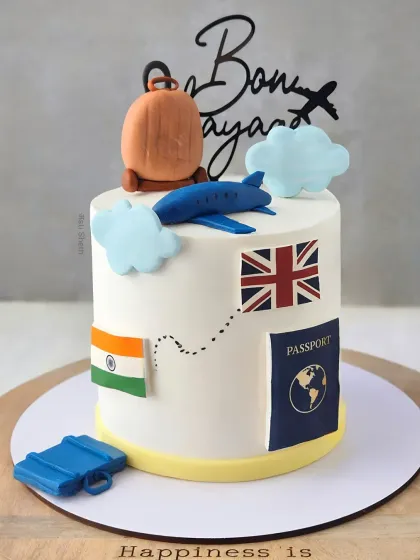 A Bon Voyage cake with a travel theme, featuring flags, a passport, and an airplane. This is my signature Mocha Orange flavour.