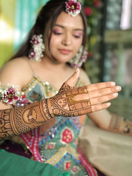 This photo highlights the side and back of the hand, showing the continuity of the design as it wraps around the arm.