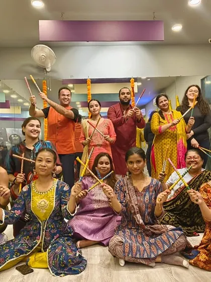 Happy faces from our Dandiya night, with members dressed in traditional attire.