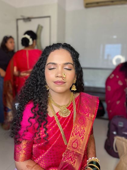 Another angle of Shivani's engagement look, showing the soft, skin-like finish of the makeup.