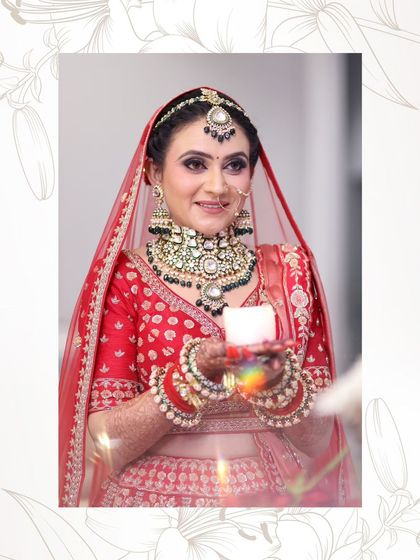 A beautiful portrait of the bride holding a candle. The soft light illuminates her glowing skin and intricate jewelry.